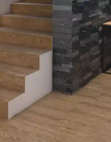 Degrau cerâmico Tundra 33x120 com efeito madeira aplicado em escada interior com pavimento contínuo