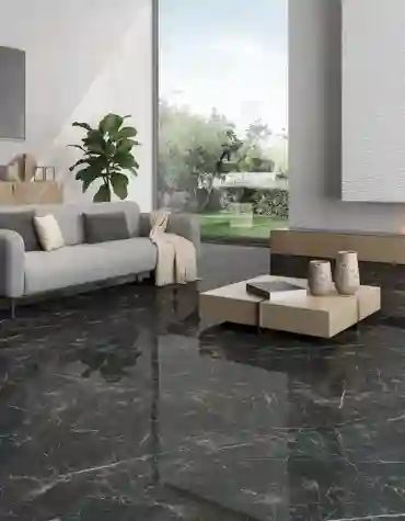 Detalhe de sala com pavimento cerâmico Gauguin preto polido – mármore negro com veios dourados