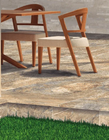 Degrau cerâmico Bahamas 33x120 com acabamento boleado aplicado em escadas de terraço com pavimento natural